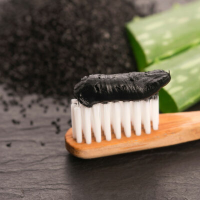 Consider these pros and cons before using charcoal toothpaste